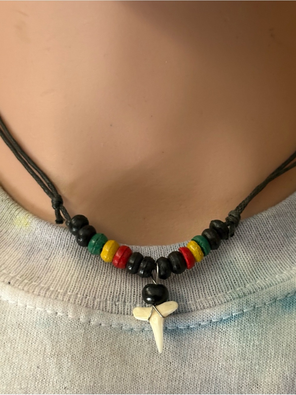 Handmade Black Bead Necklace with Red, Yellow & Green Accents and Tooth Pendant
